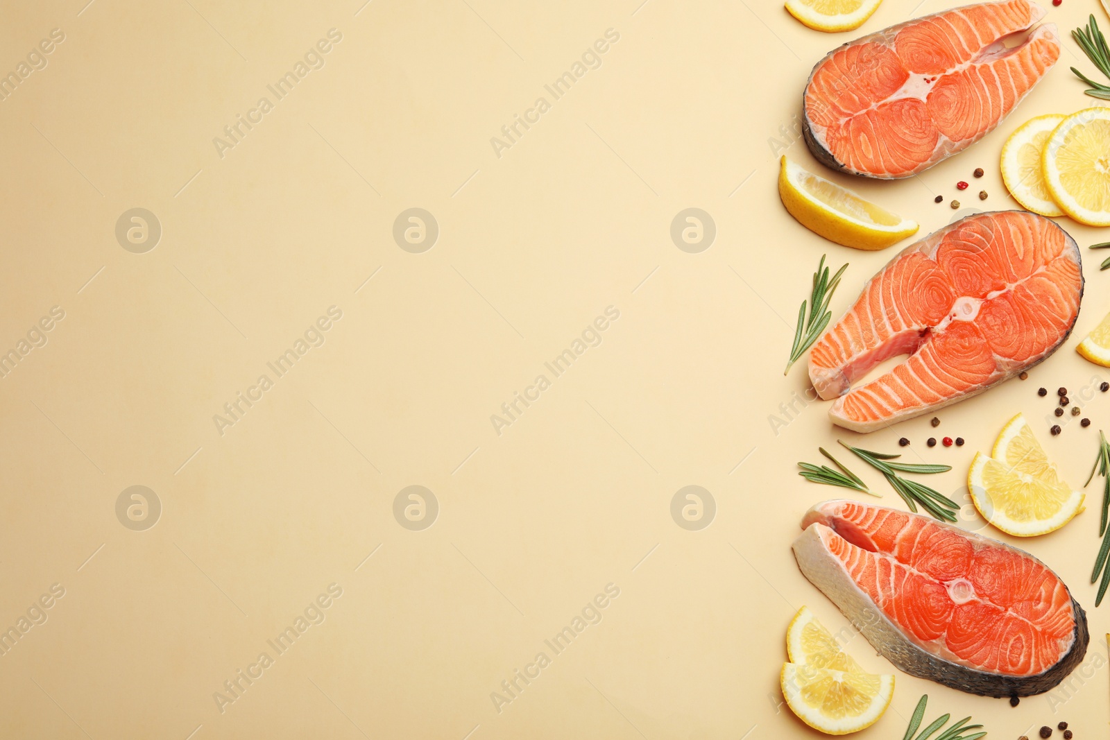 Photo of Flat lay composition with salmon steaks on light background. Space for text