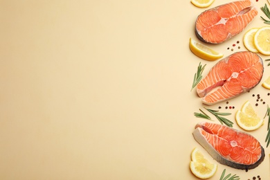 Flat lay composition with salmon steaks on light background. Space for text