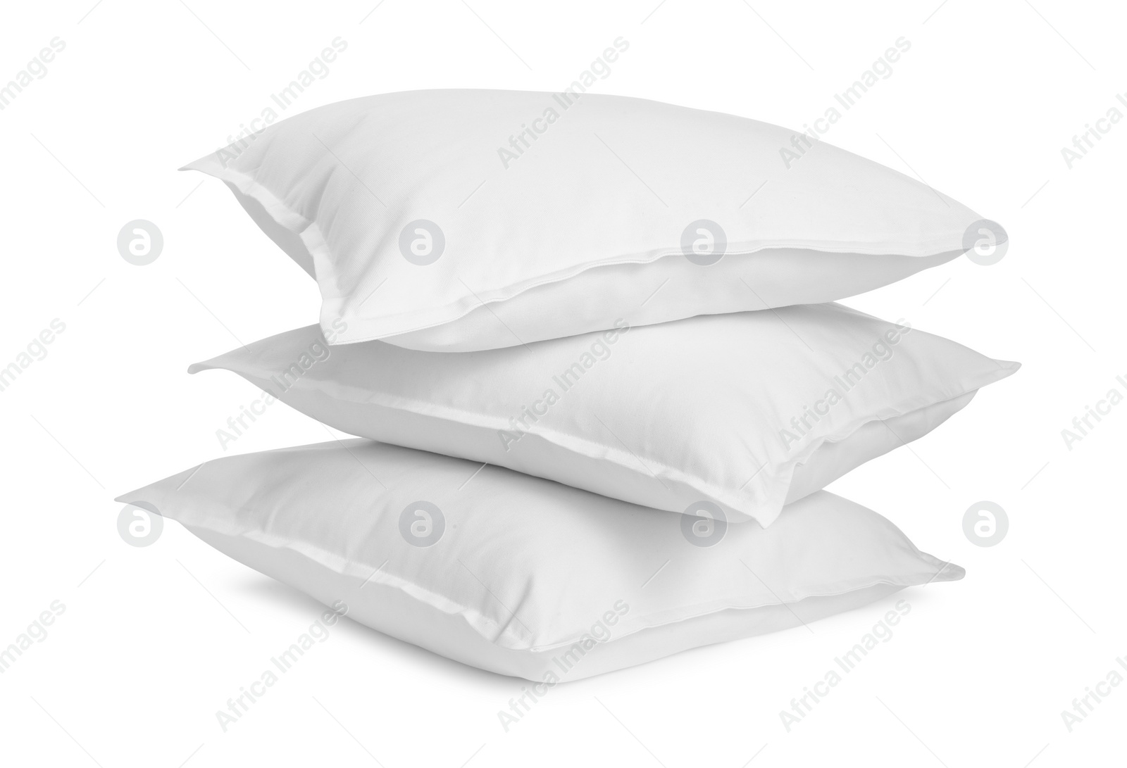 Photo of Three new soft pillows isolated on white