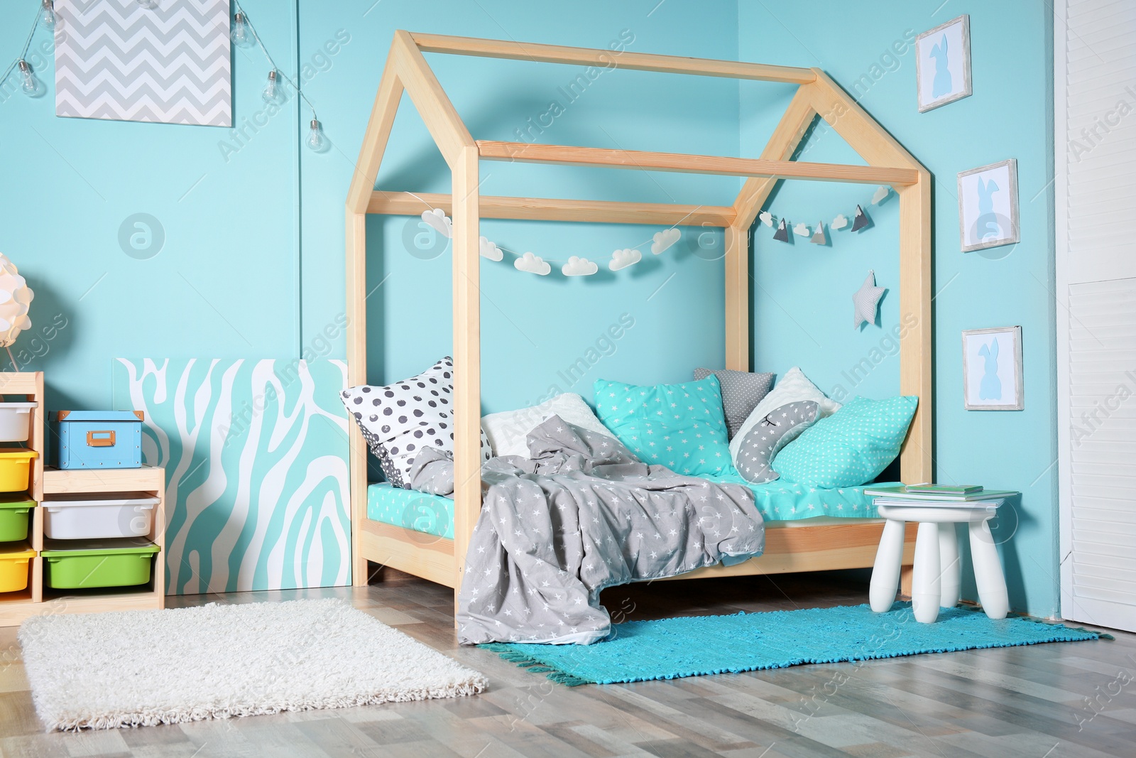 Photo of Comfortable bed in modern children room