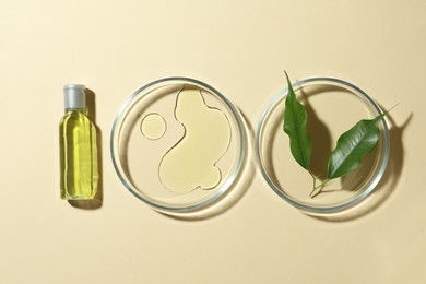 Photo of Petri dishes with cosmetic products and leaves on beige background, flat lay