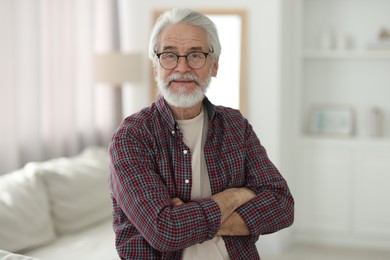 Photo of Portrait of happy grandpa with glasses indoors