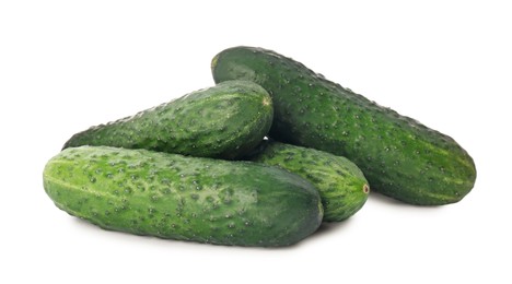 Photo of Whole fresh green cucumbers on white background