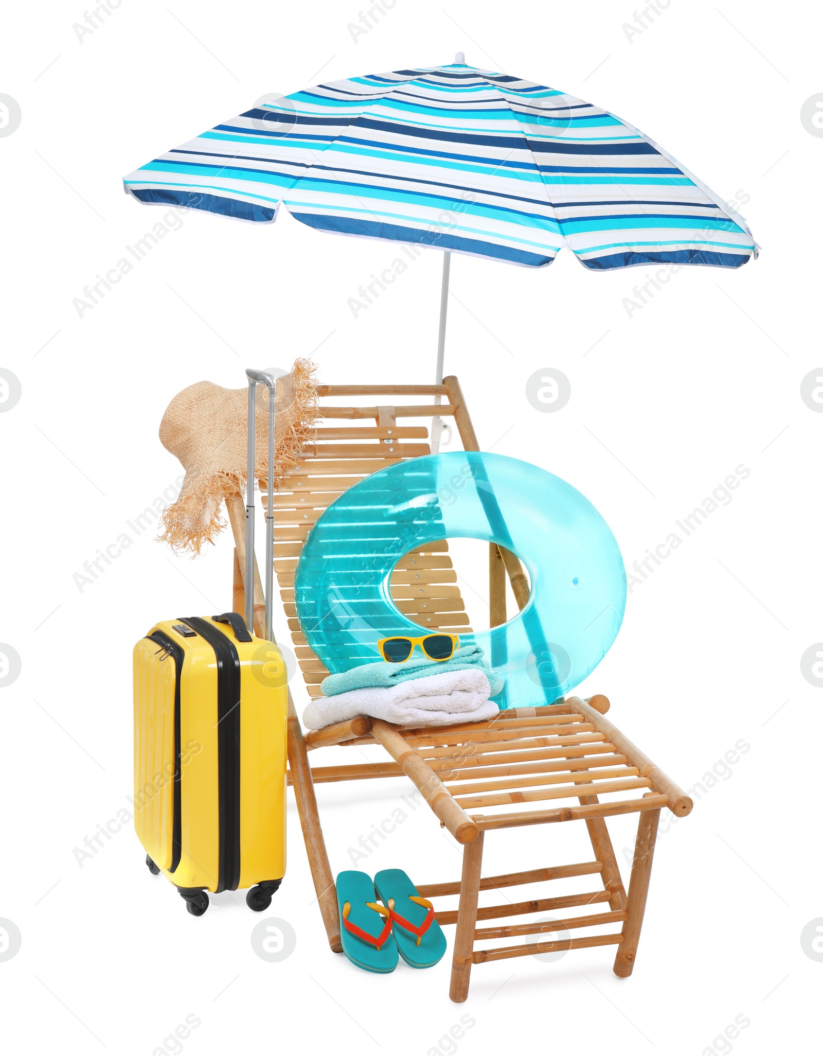 Photo of Deck chair, umbrella, suitcase and beach accessories isolated on white