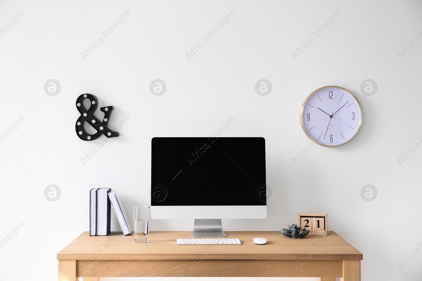 Photo of Comfortable workplace with computer on desk in home office