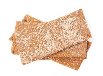 Photo of Fresh crunchy rye crispbreads isolated on white, top view