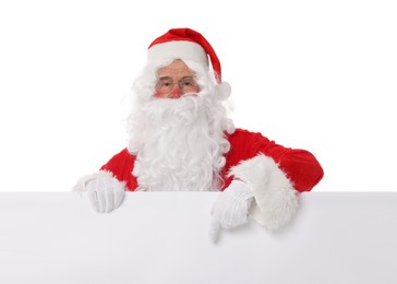 Photo of Man in Santa Claus costume posing and pointing on white background