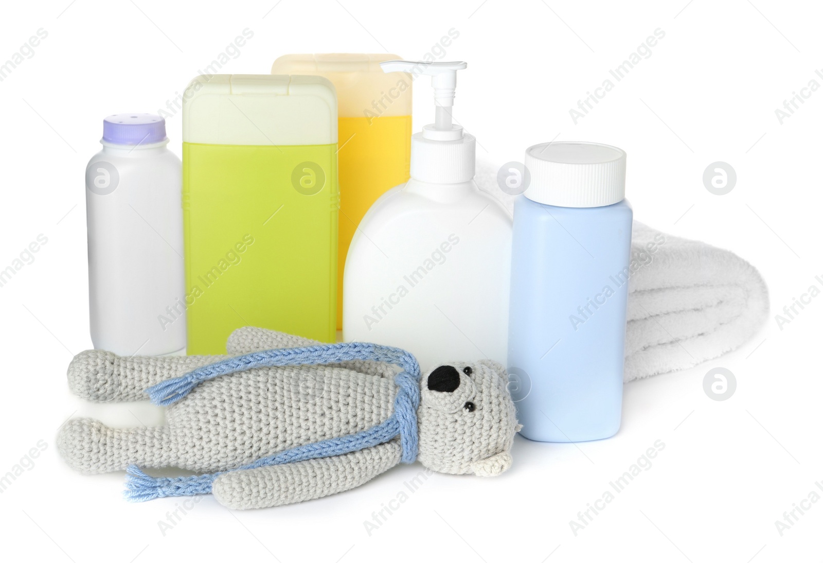 Photo of Set of baby cosmetic products, toy bear and towel on white background