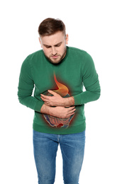 Young man suffering from stomach pain isolated on white
