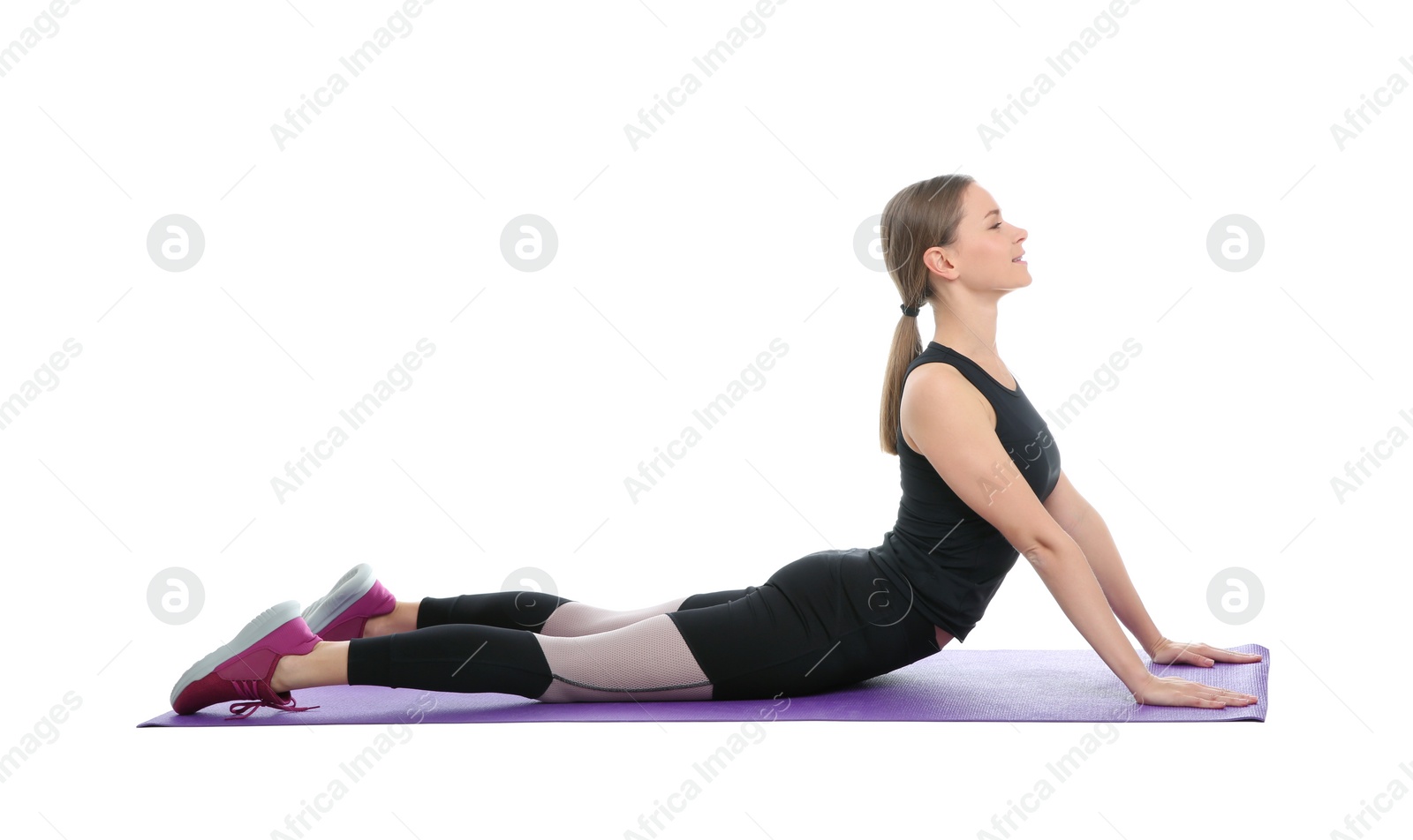 Photo of Young woman doing sports exercises isolated on white. Home fitness