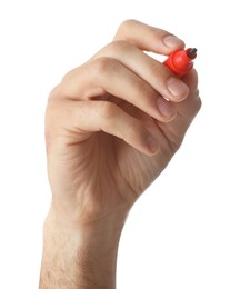 Man holding red marker on white background, closeup