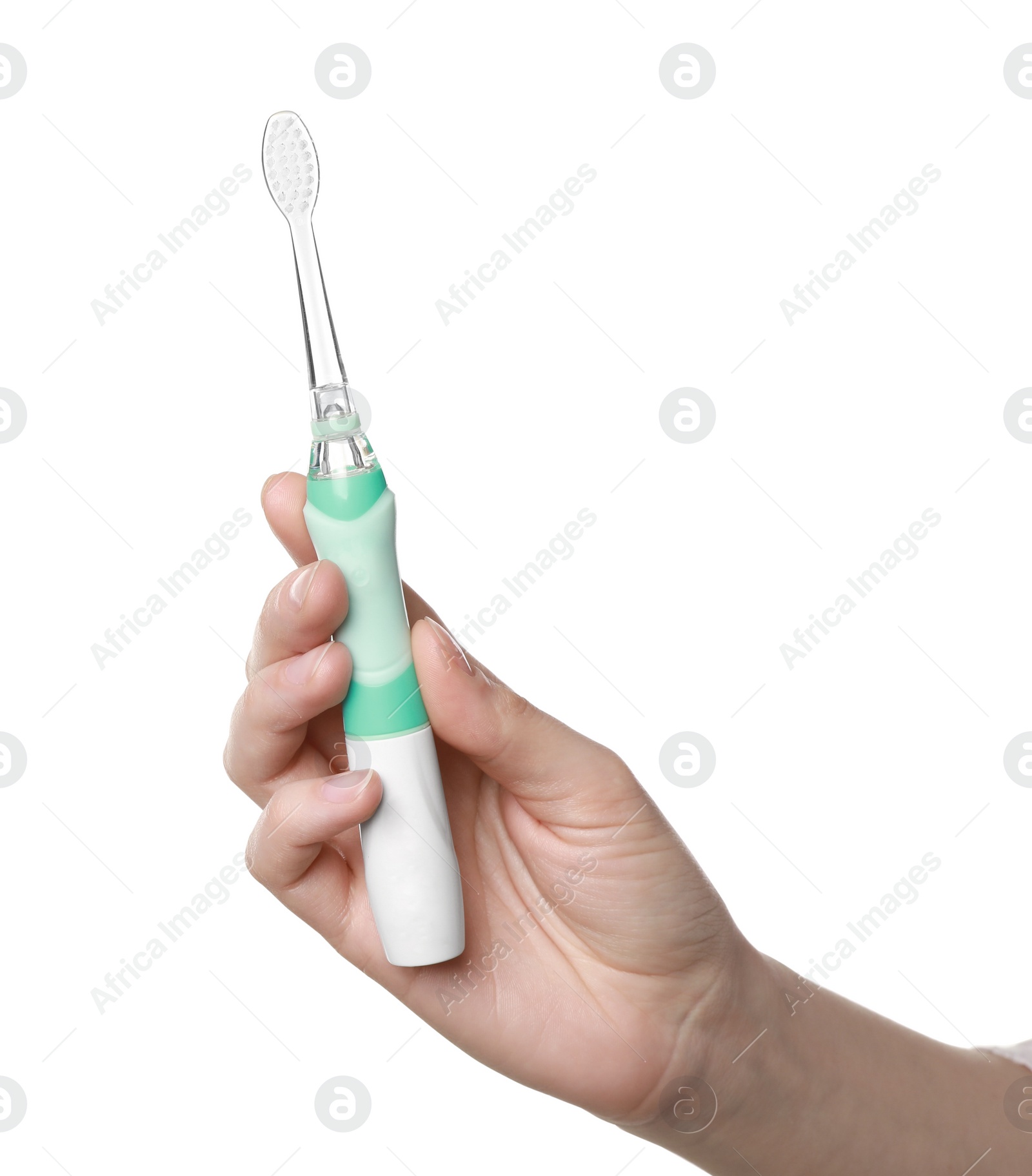 Photo of Woman holding electric toothbrush on white background, closeup