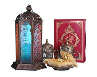 Photo of Decorative Arabic lantern, Quran, baklava and coffee on white background