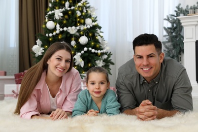 Happy family in room decorated for Christmas