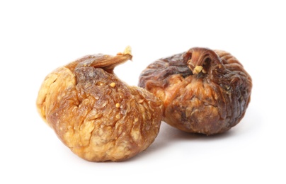 Photo of Delicious dried fig fruits on white background. Organic snack