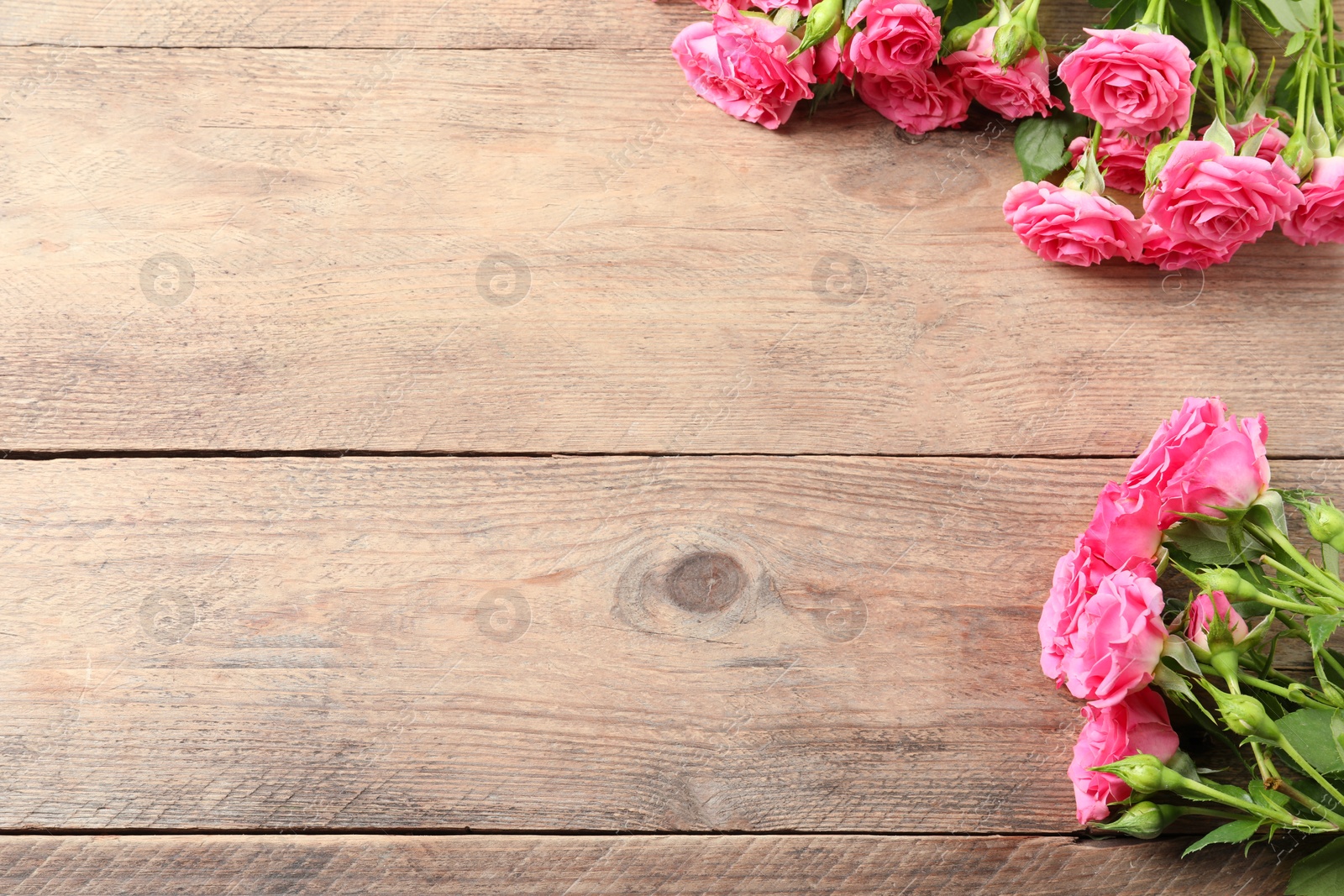 Photo of Happy Mother's Day. Beautiful flowers on wooden table, space for text