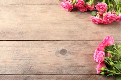 Photo of Happy Mother's Day. Beautiful flowers on wooden table, space for text