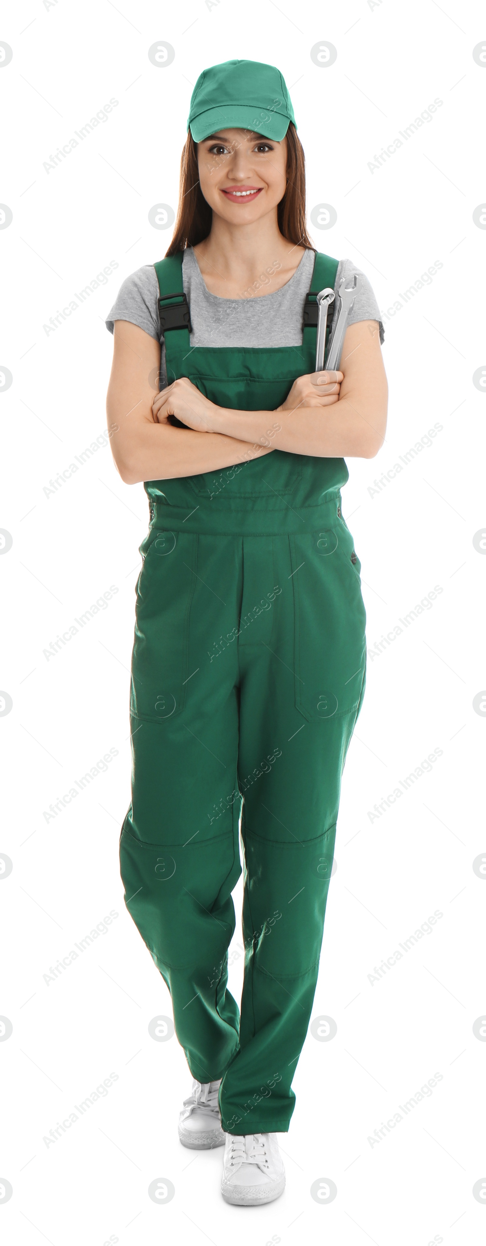 Photo of Full length portrait of professional auto mechanic with wrenches on white background