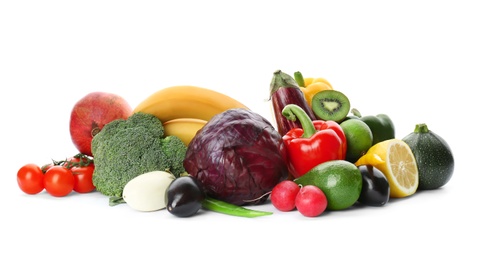 Rainbow collection of ripe fruits and vegetables on white background