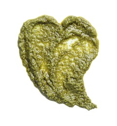 Photo of Heart shaped sample of tasty pesto sauce isolated on white, top view