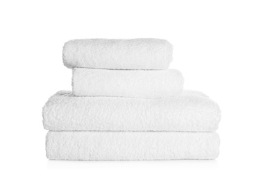 Photo of Stack of clean soft towels on white background