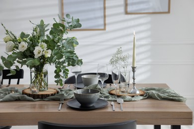 Festive table setting with beautiful tableware and decor indoors