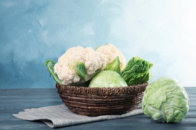 Photo of Bowl with tasty cabbages on wooden table