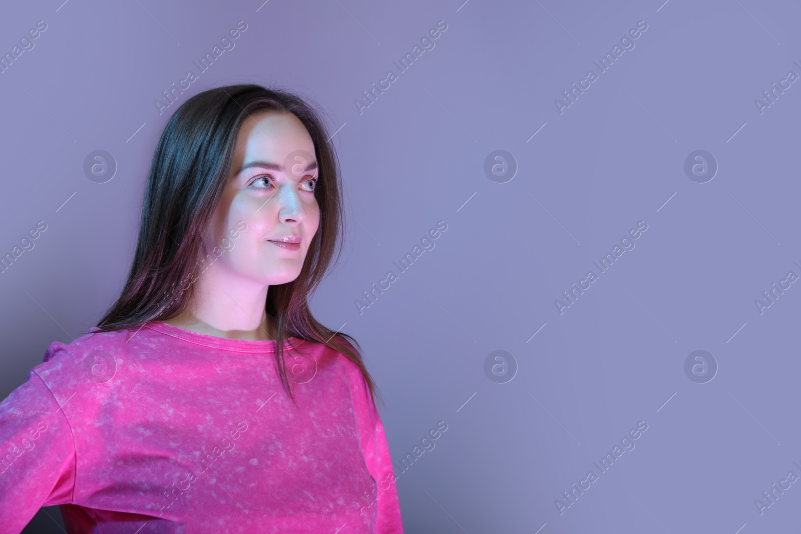 Photo of Portrait of beautiful woman on color background, space for text