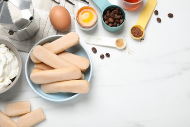 Photo of Flat lay composition with tiramisu ingredients on white table, space for text