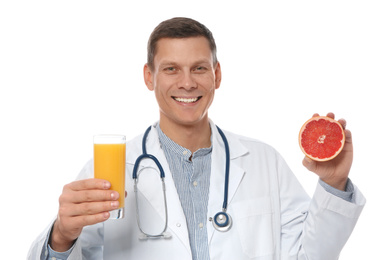 Photo of Nutritionist with glass of juice and grapefruit on white background