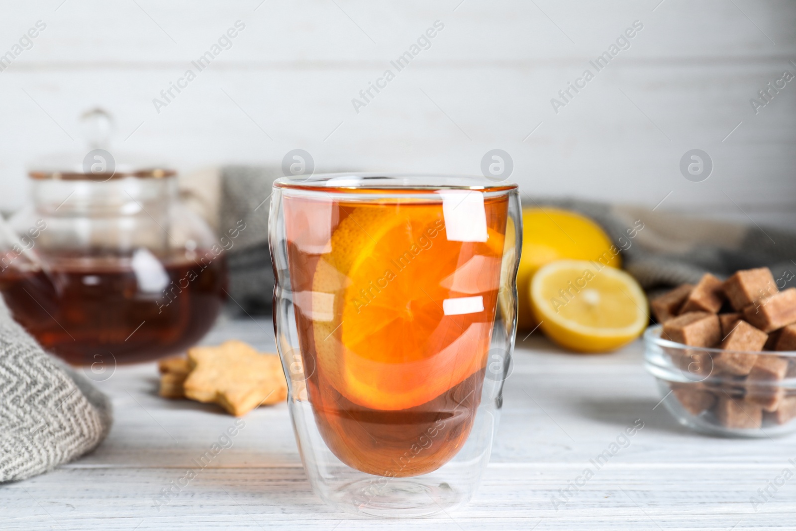 Photo of Cup of hot drink on white wooden table. Cozy autumn atmosphere