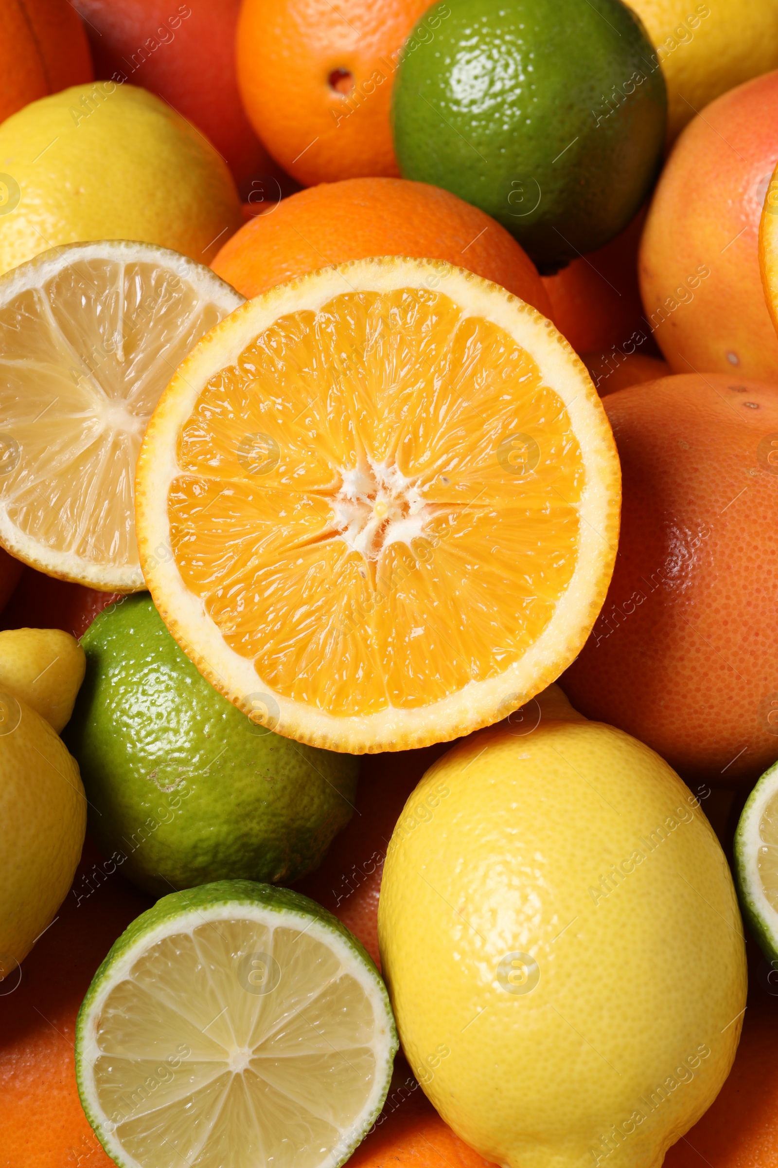 Photo of Different fresh citrus fruits as background, closeup