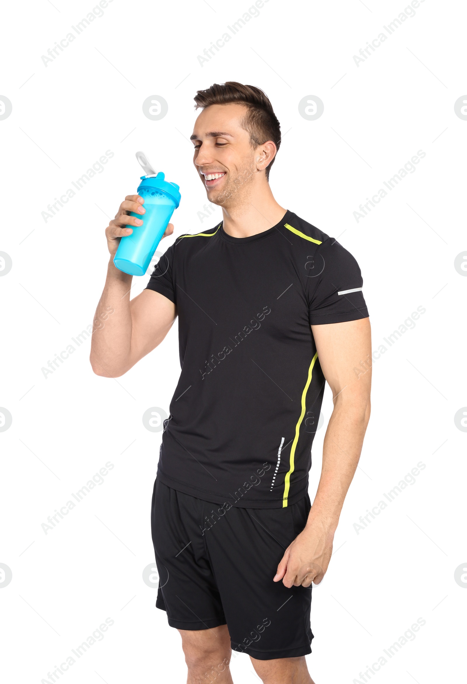 Photo of Portrait of man drinking protein shake on white background