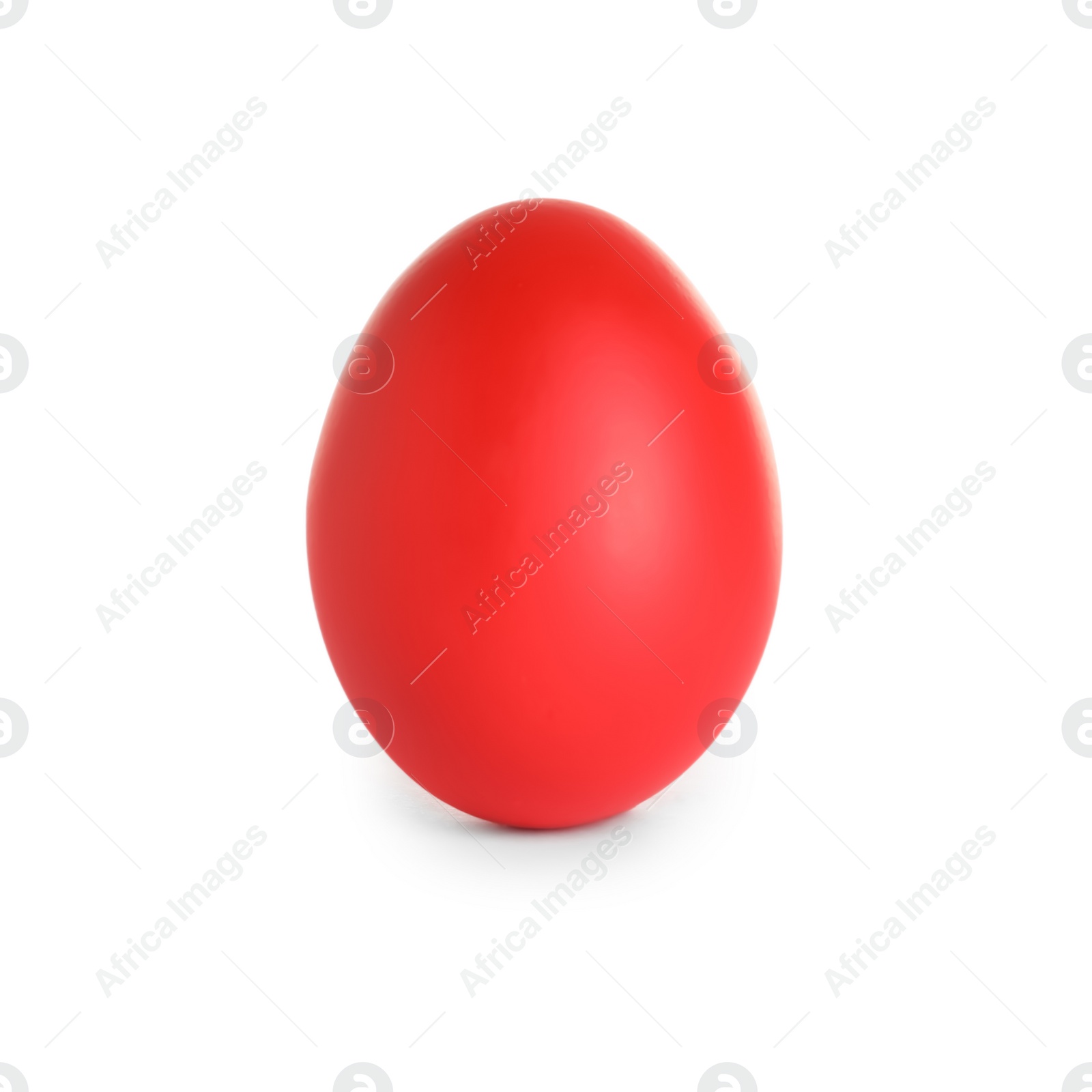 Photo of Red dyed Easter egg on white background