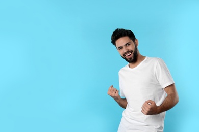 Photo of Portrait of happy young man on color background. Space for text