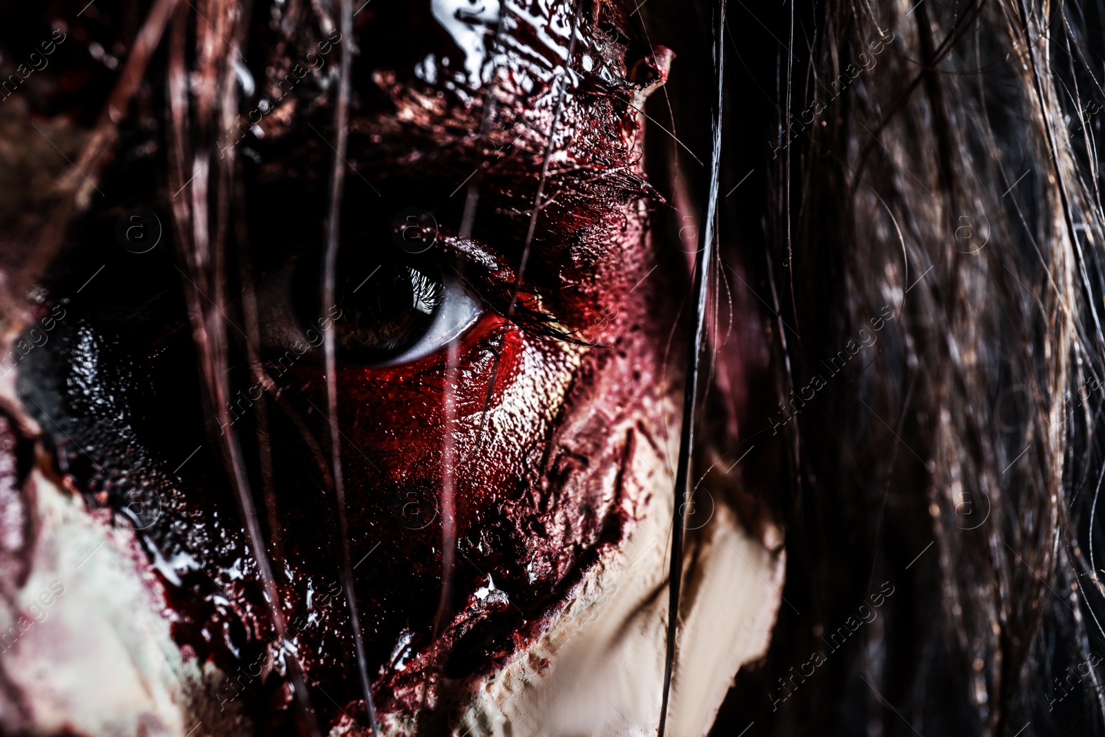 Photo of Closeup view of scary zombie. Halloween monster