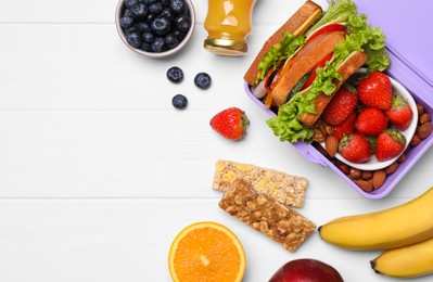 Photo of Lunch box with healthy food on white wooden table, flat lay. Space for text
