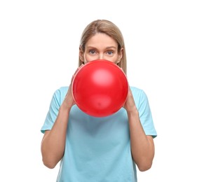 Woman blowing up balloon on white background