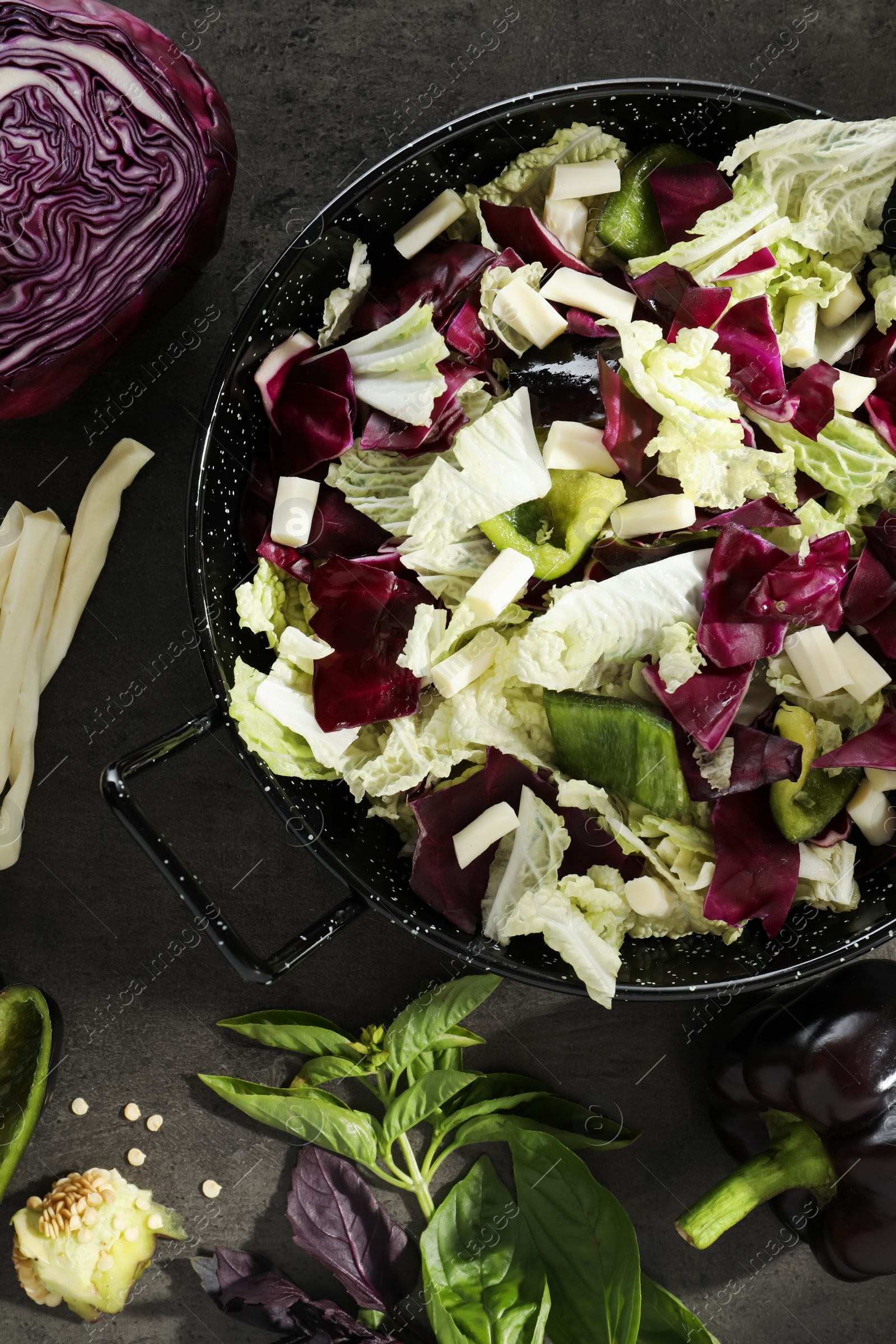 Photo of Delicious salad with Chinese cabbage, suluguni cheese and bell pepper on grey table, flat lay