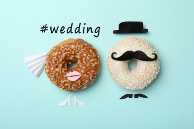 Bride and groom made with donuts and hashtag Wedding on turquoise background, flat lay