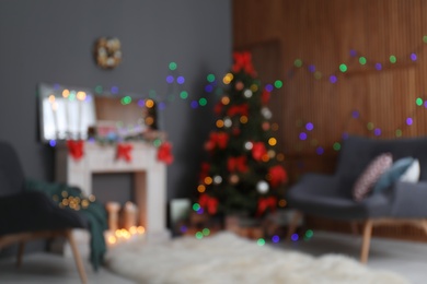 Photo of Blurred view of stylish living room interior with decorated Christmas tree