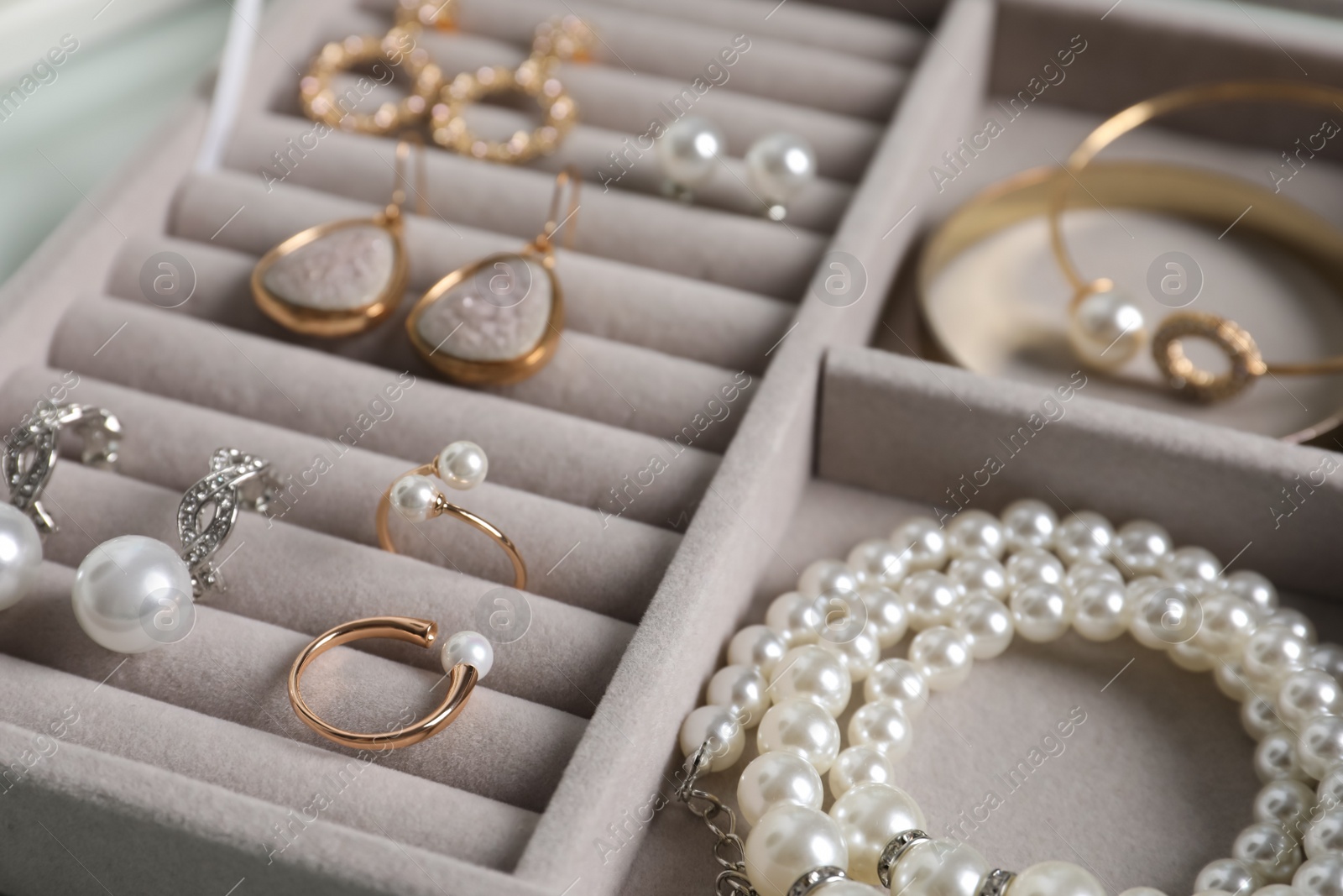 Photo of Box with luxurious pearl jewelry, closeup view