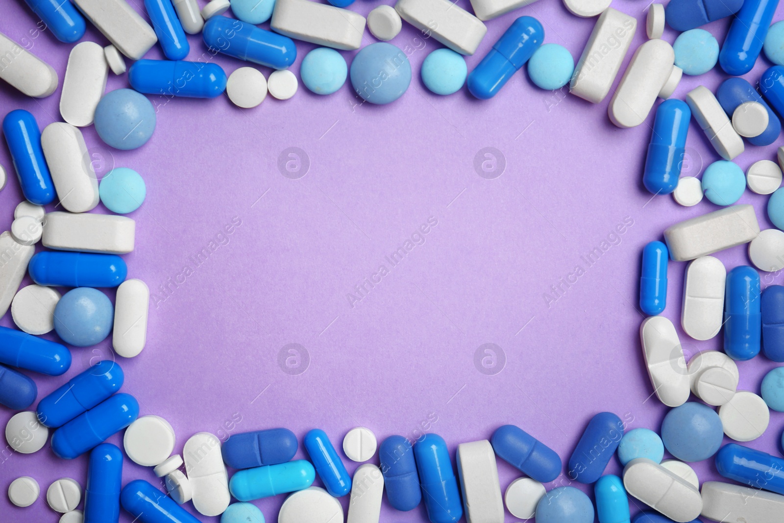 Photo of Flat lay composition with pills and space for text on color background. Medical treatment