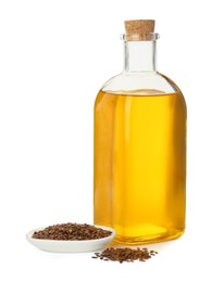 Photo of Vegetable fats. Flax oil in glass bottle and seeds isolated on white