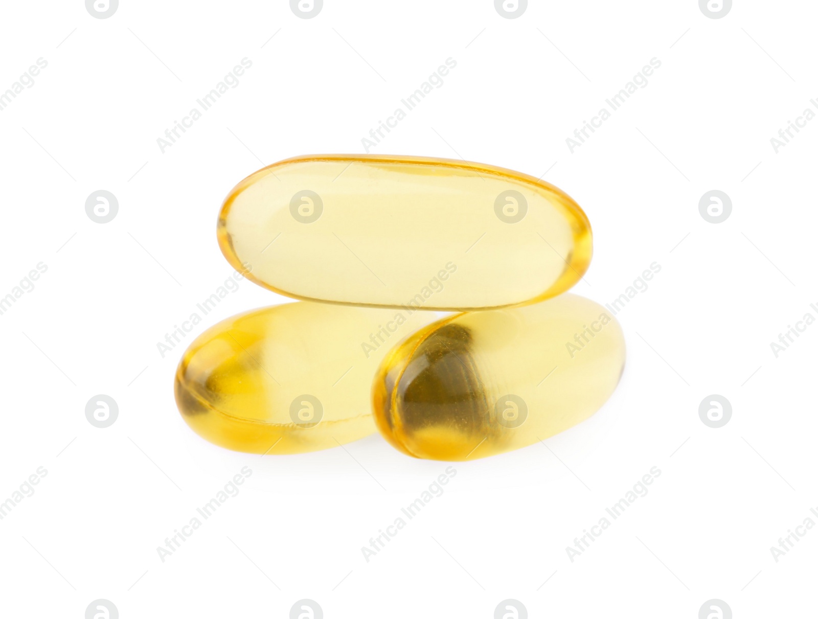 Photo of Yellow vitamin capsules isolated on white. Health supplements