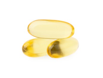 Yellow vitamin capsules isolated on white. Health supplements