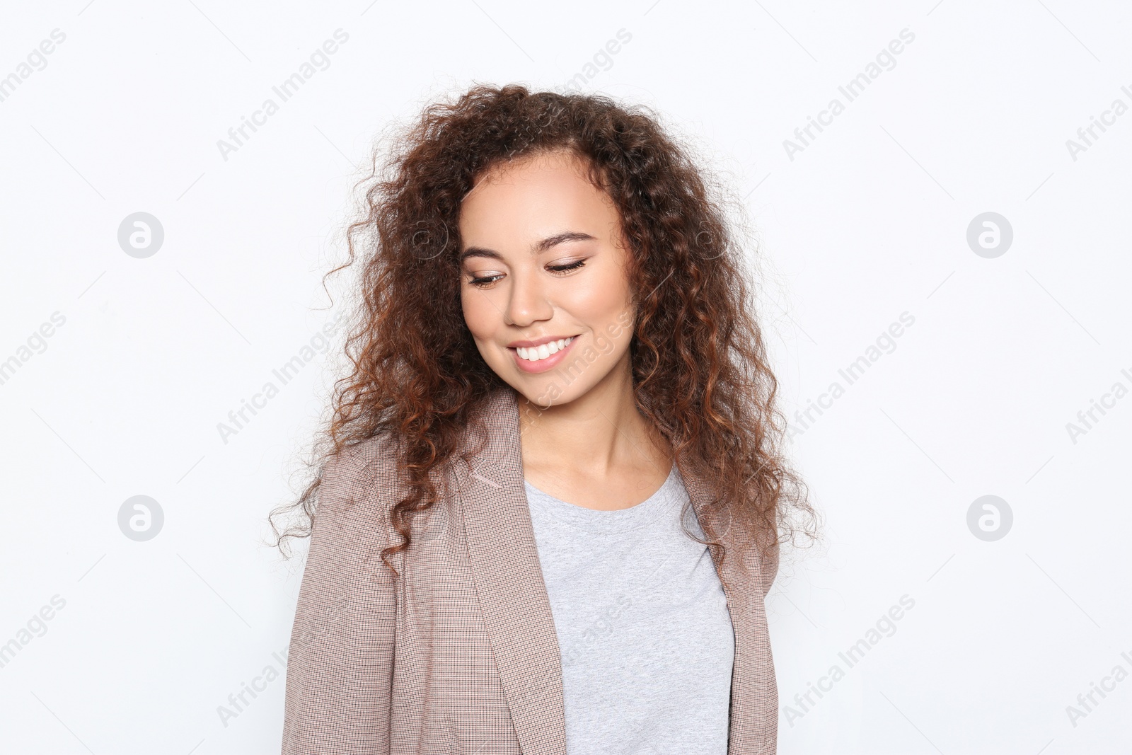 Photo of Young African-American woman with beautiful face on white background