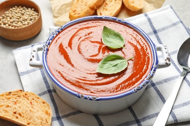 Dish with delicious fresh homemade tomato soup on table