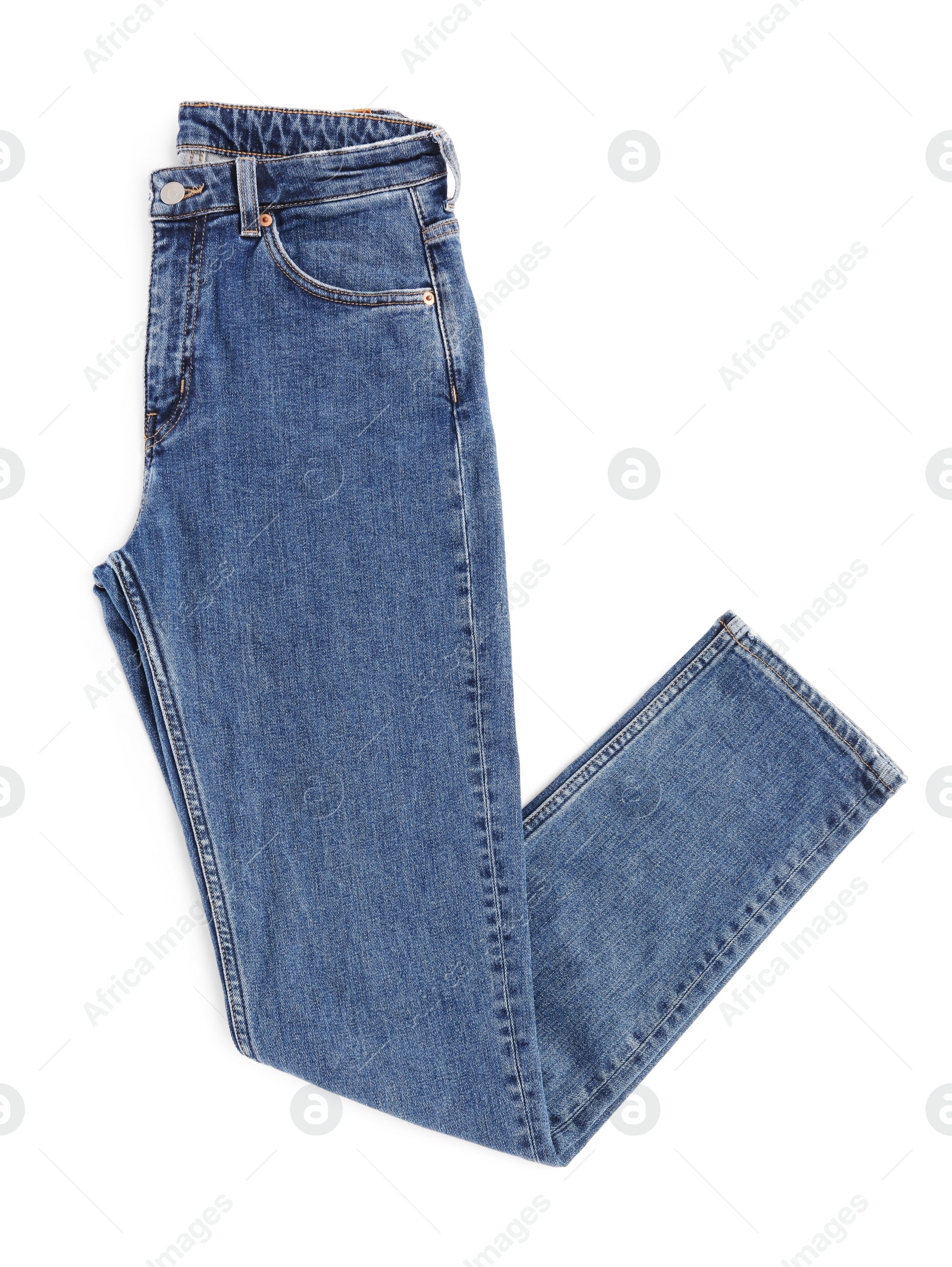 Photo of Dark blue jeans isolated on white, top view. Stylish clothes