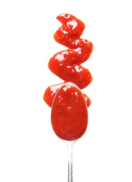 Delicious tomato sauce and spoon on white background, top view